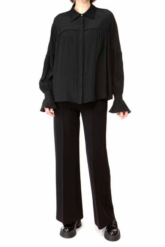 IVI collection black blouse with pleat detail in the font and back with a golden button at the top made from 100% silk from aw24 collection