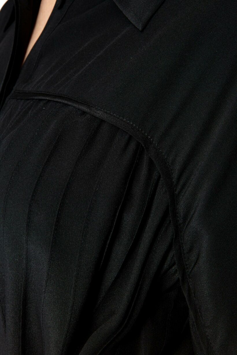 IVI collection black blouse with pleat detail in the font and back with a golden details made from silk and ruffle details on the sleeve from aw24 collection