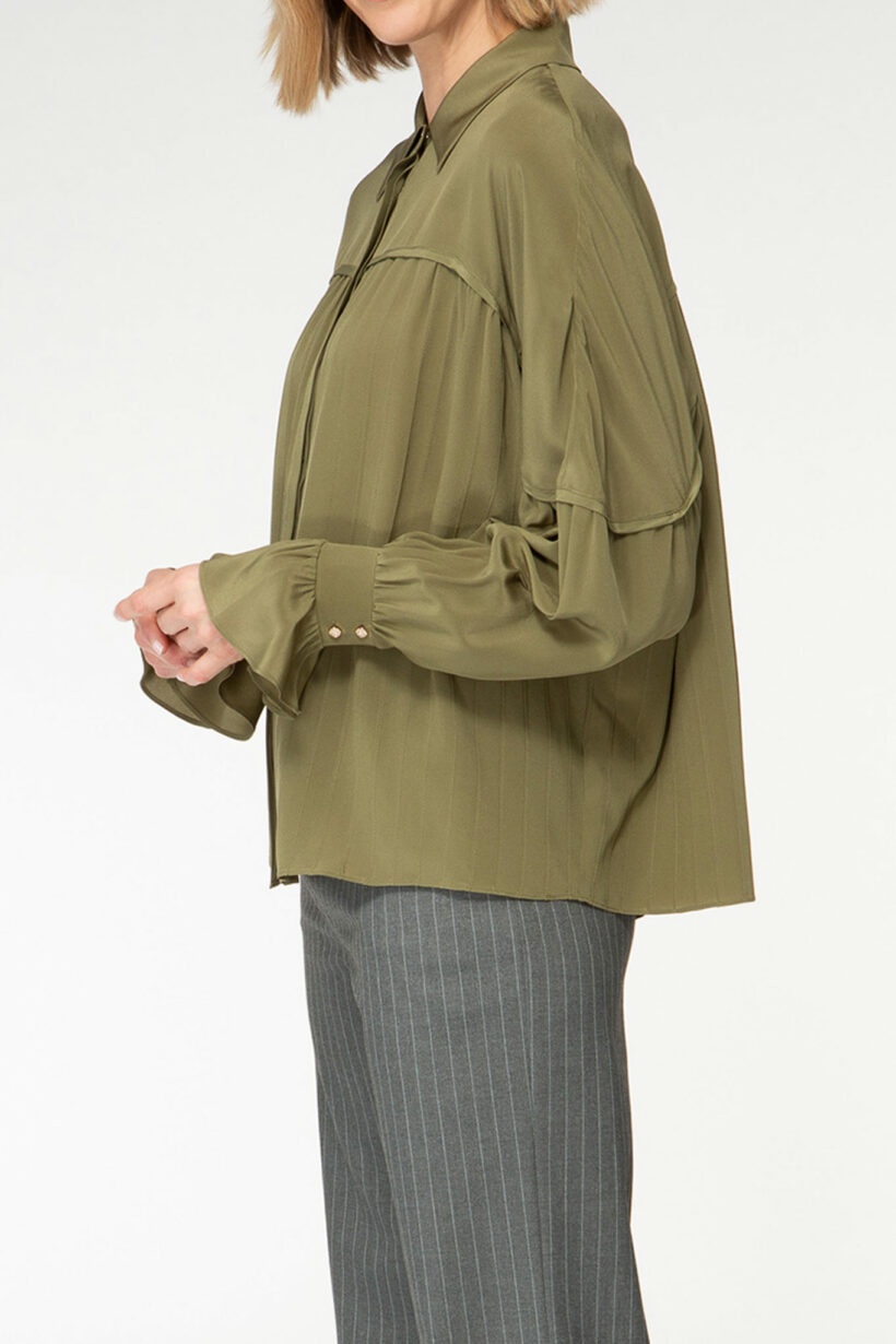 IVI collection olive green blouse with pleat detail in the font and back with a golden button at the top made from 100% silk from aw24 collection