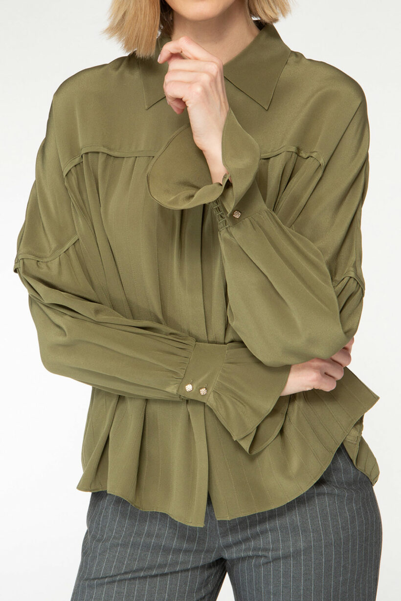 IVI collection olive green blouse with pleat detail in the font and back with a golden button at the top made from 100% silk from aw24 collection