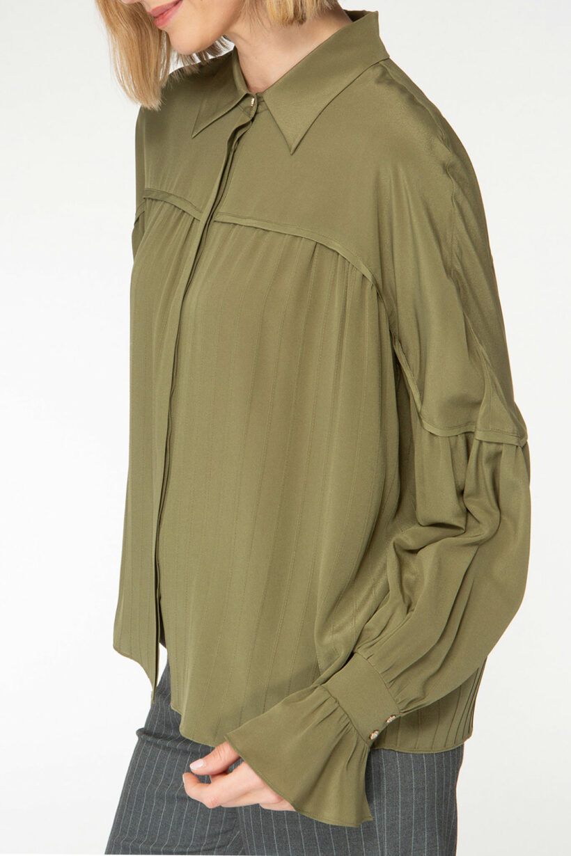 IVI collection olive green blouse with pleat detail in the font and back with a golden button at the top made from 100% silk from aw24 collection